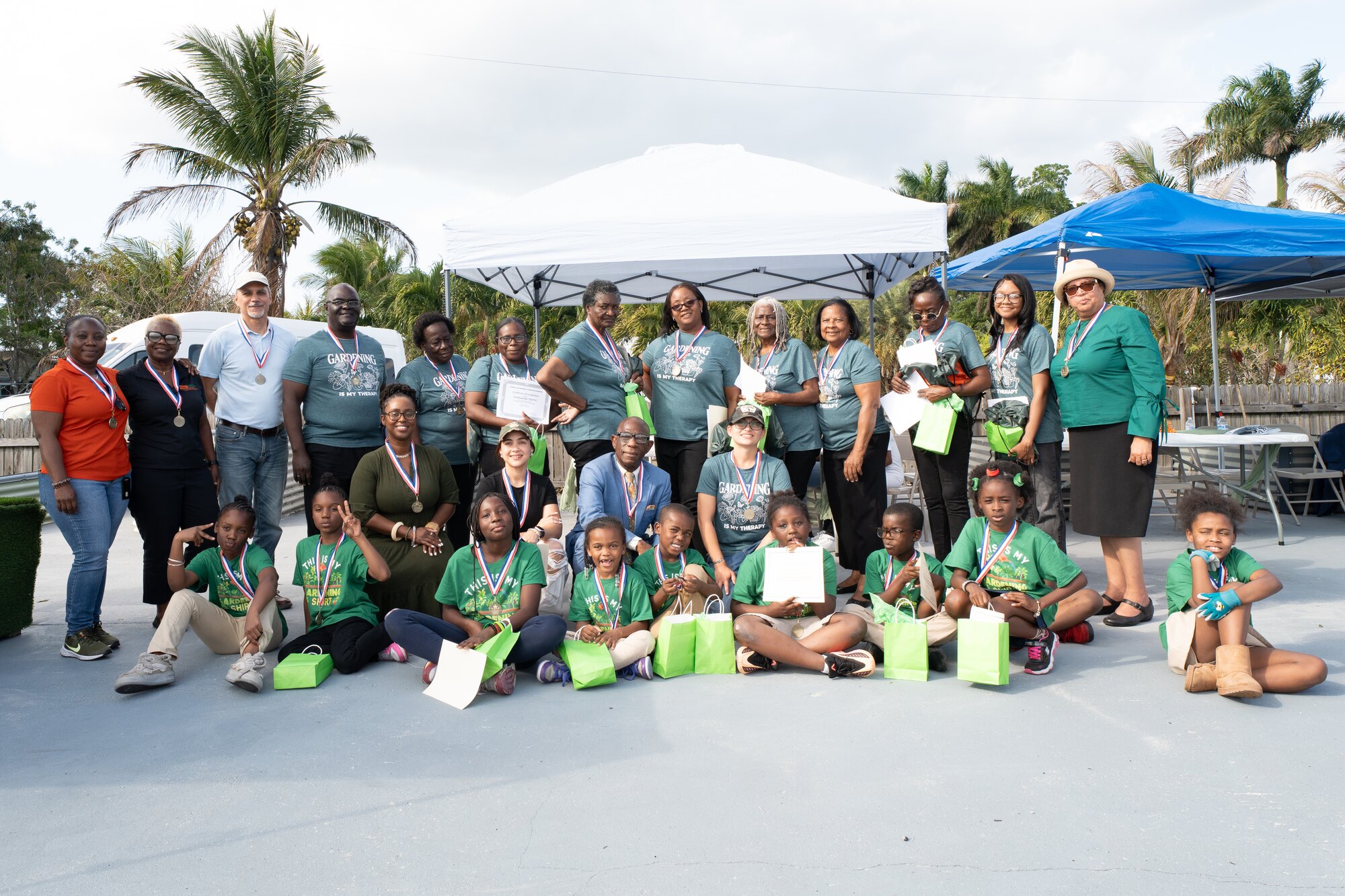 Children and community leaders celebrating their garden learning and achievements