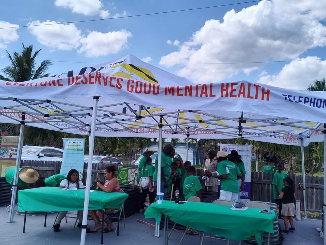 Federation volunteers promoting mental wellness at a community event in the Glades