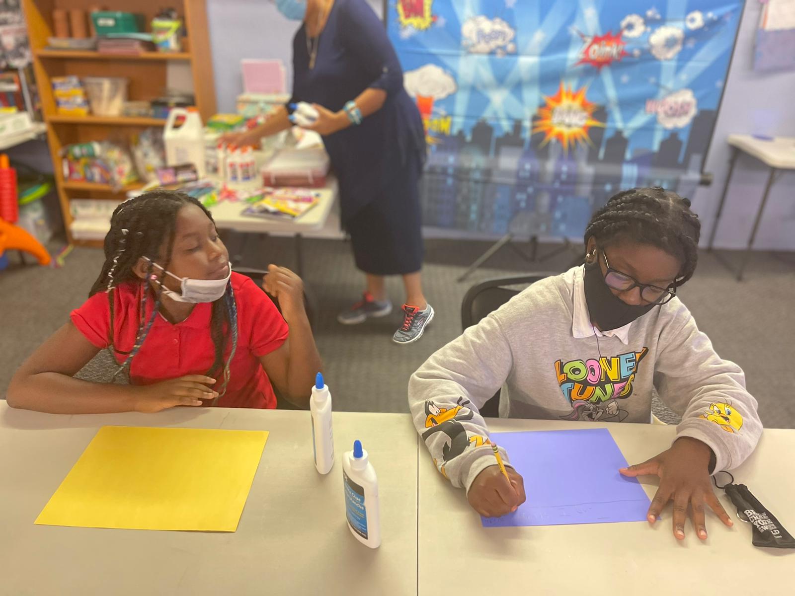 Children creating art together during a Federation youth activity